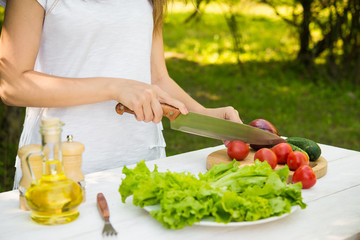 woman preparing breakfast in nature