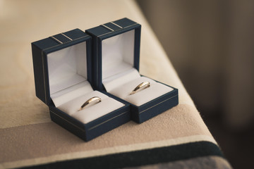 A pair of golden rings in the box