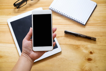 Asian woman hand holding smart phone with white blank empty scre
