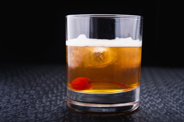 alcoholic cocktail with cherry