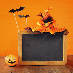 Halloween holiday concept. Witch hat, cute pumpkin