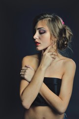 Spring model with flowers in her hair and fashion makeup . Summer girl with trendy make up and hairstyle .