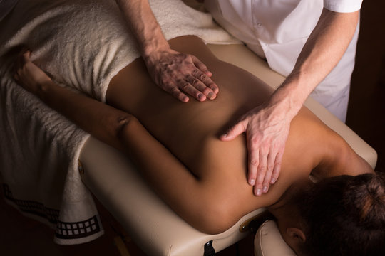 Gentle hands of an experienced masseur