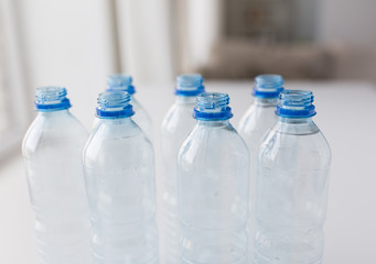 close up of bottles with drinking water on table