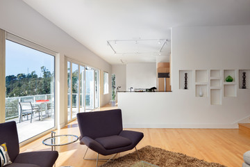 Fototapeta na wymiar Modern living room with amazing view and large windows.