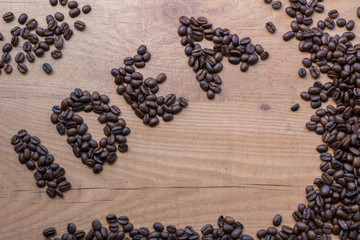 Sign of Idea concept drawn among roasted brown beans of coffee
