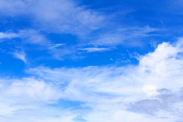 Obraz premium Blue sky background with white clouds. The vast blue sky and clouds sky on sunny day. White fluffy clouds in the blue sky.