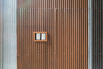 Light switches on old tin wall background with copy space