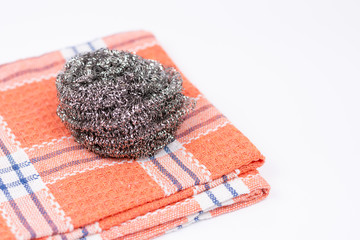 Cleaning dish wire on the kitchen dishtowel