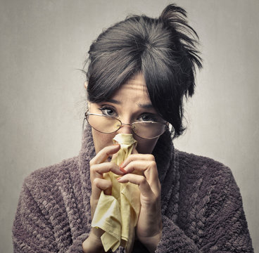 Sick woman holding a handkerchief 