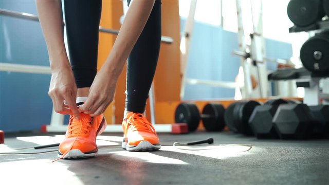 Girl tying shoelaces sneakers and takes a skipping rope 20s. 1080p Slow Motion
