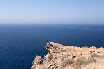 The protrusion rock stretching into the endless sea