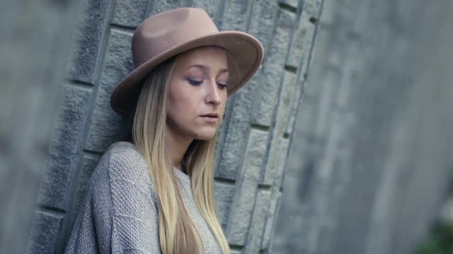 Sad lonely woman smoking cigarette and thinking