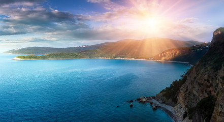 Panoramic landscape of the rocky coastline sea and Jaz Beach at sunshine. Budva, Montenegro. Adriatica. Top view.