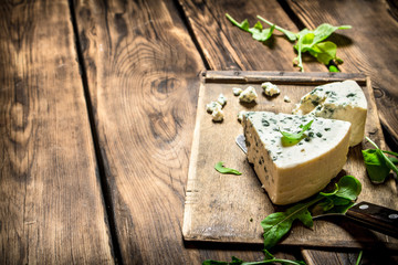 Italian cheese and herbs on Board.