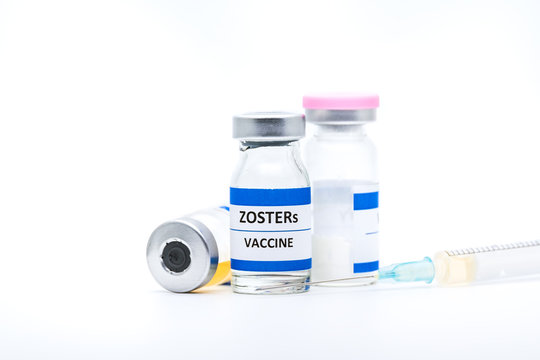 zoster vaccine with syringe on white background
