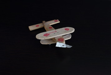 
I also know how to fly

toy airplane from rough tree on a dark background. Propeller made of...