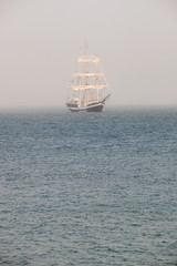 Mysterious sailing ship surrounded fog