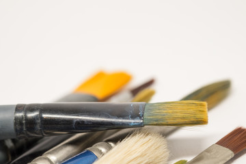 Several paintbrushes on a white background.