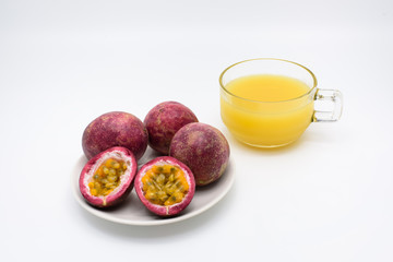 Passion fruit juice with passion fruit in a cup isolated on whit