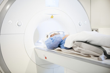 Patient Wearing Head Coil During MRI Scan - obrazy, fototapety, plakaty