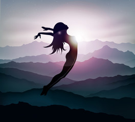 girl jumping in mountains at sunset freedom