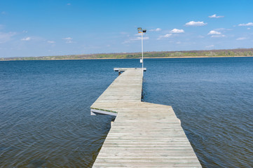 Empty wooden pier on Dnepr river in Ukraine