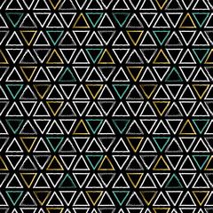 Grunge triangle shapes seamless pattern in gold