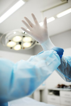 surgeon's hands in gloves closeup. Surgeons team preparing for a complex operation.
