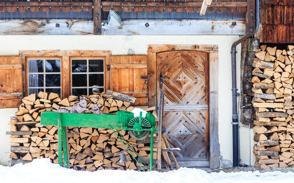 Country house with a supply of firewood for the winter mountains