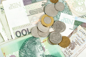 Polish zloty in notes and coins, photograph with depth of field.