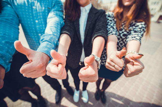 Hands of young people in the nature