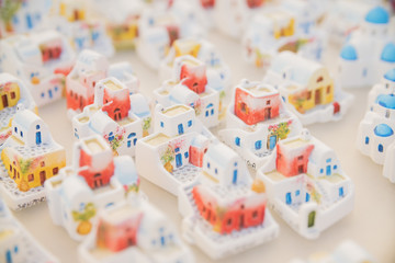 GREECE, SANTORINI - JULY 20, 2016: the background of the many Souvenirs in the form of the Greek houses