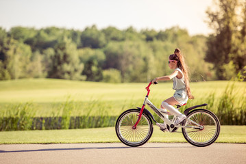 Fototapeta premium Girl riding bike