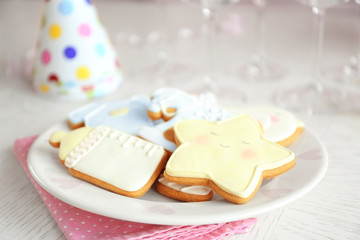 Fototapeta na wymiar Baby glazed cookies on decorated table