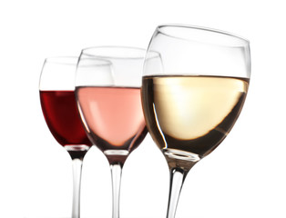 Glasses of rose, red and white wine isolated on white