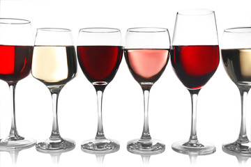 Glasses of rose, red and white wine isolated on white