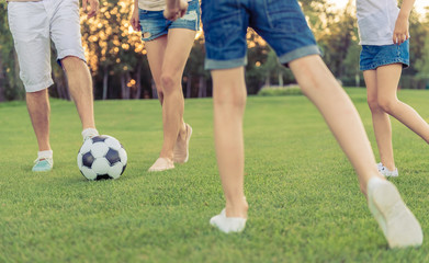 Family playing soccer