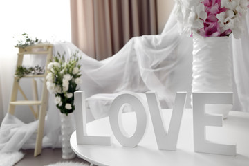 Beautiful room interior with stylish decor and flowers