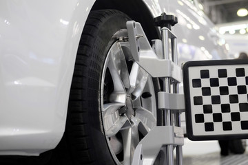  Wheel alignment equipment on a car