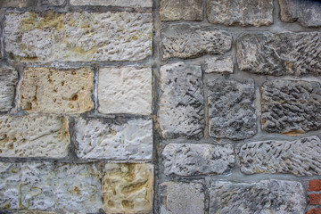 Mauer mit verschiedenen Steintypen als Hintergrund oder Textur