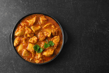 Chicken curry on dark background