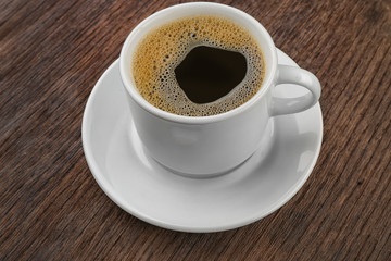 Cup of coffee wooden background