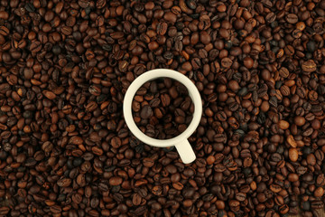 Cup in coffee beans, closeup