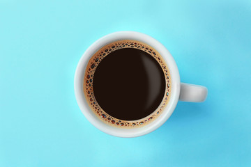 Cup of coffee on blue background