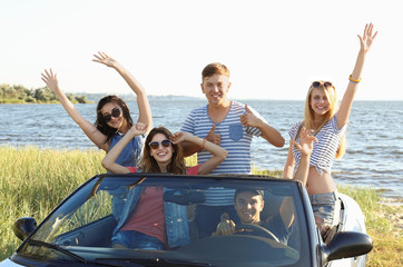 Happy friends in car