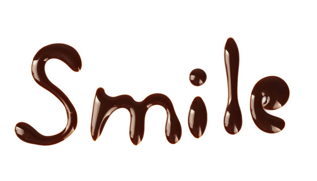 Word SMILE made of chocolate, isolated on white