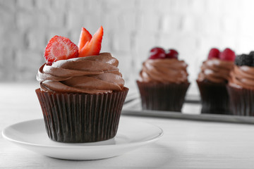 Chocolate cupcakes with berries on top