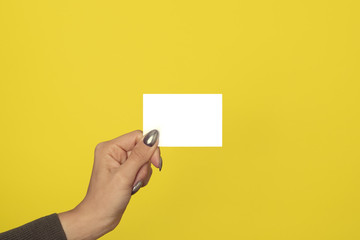 woman hand shows blank business card