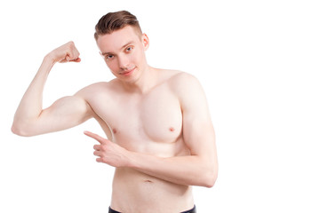Handsome man on a white background with a naked torso in blue jeans